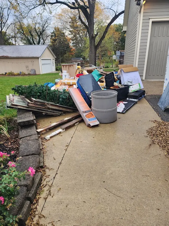 Dumpster being loaded with debris for Roofing Dumpster Rental in Escondido